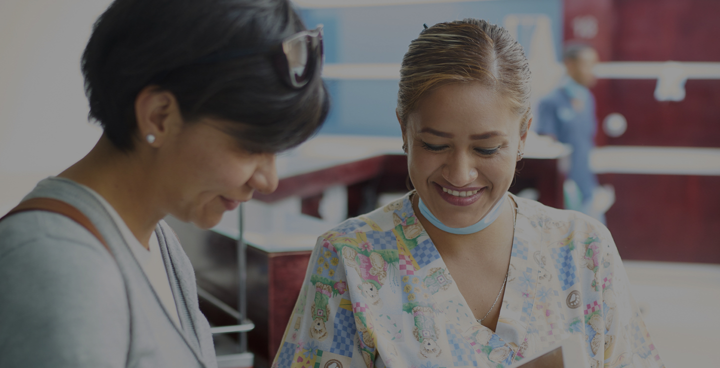 A woman and a team member discuss ways to give and volunteer at AdventHealth Cancer Institute