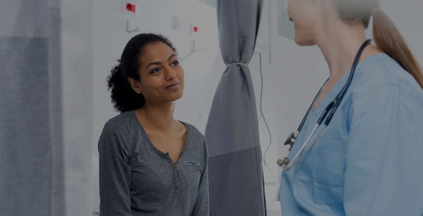 A cancer patient and a radiology specialist discusses cutting edge radiation oncology procedures and options