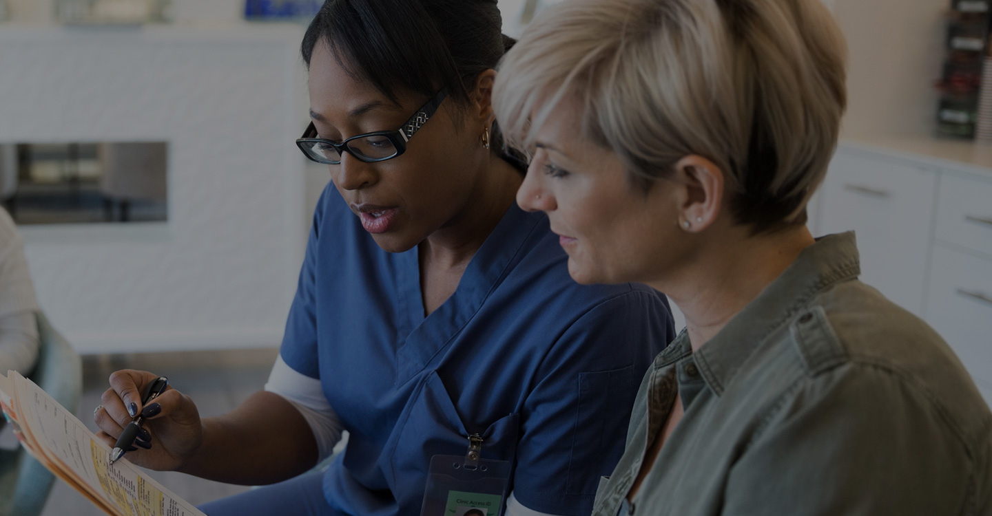 Female nurse going over results with a female patient
