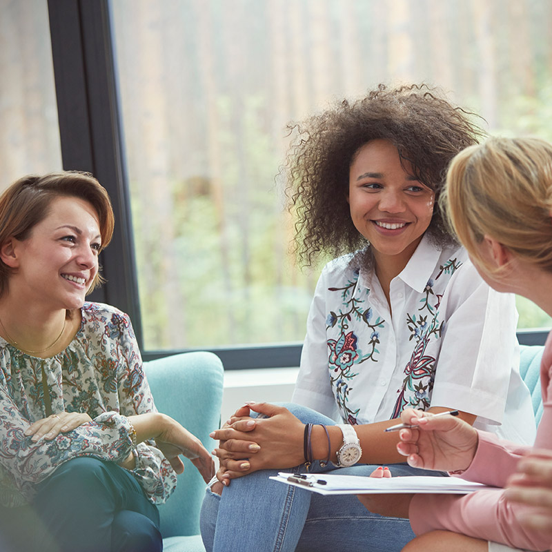 Three women talking in a support group