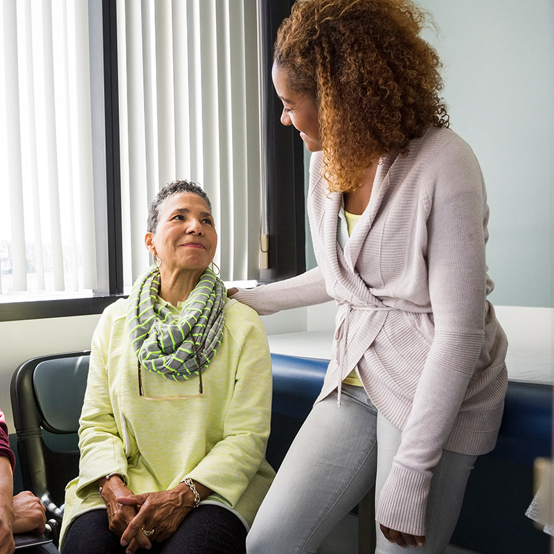 Female patient talking to a female doctor