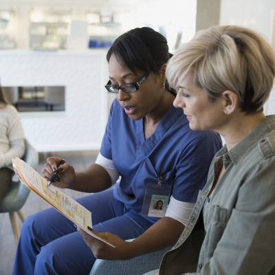 patient reviewing chart with nurse